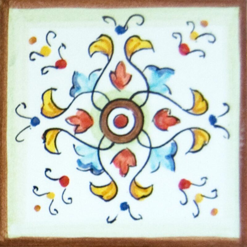 mattonella in ceramica con decoro realizzato a mano